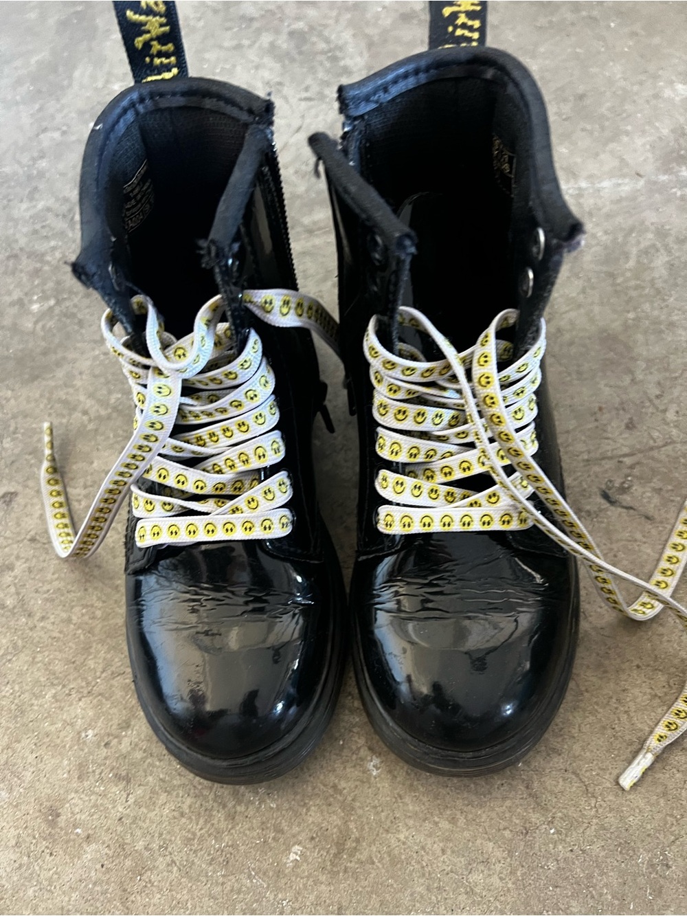 Dr. Martens Black Leather Boots with White Smiley Laces